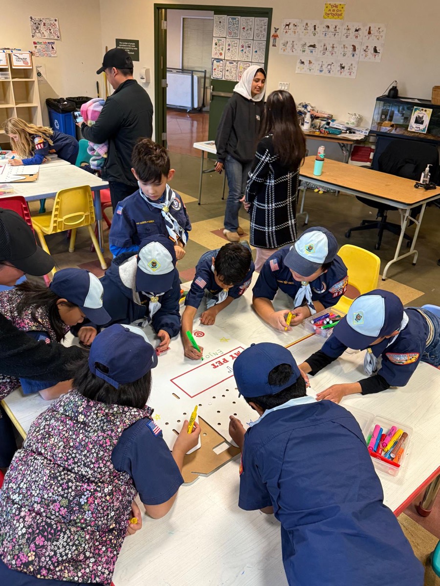 Scouts working on a craft project together in the classroom