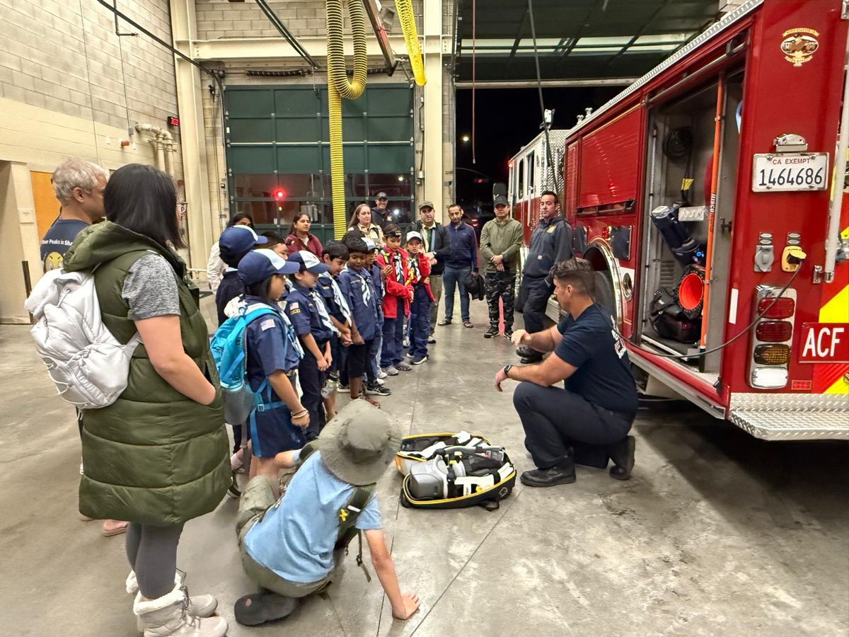 Scouts getting a night tour of the fire station and fire truck