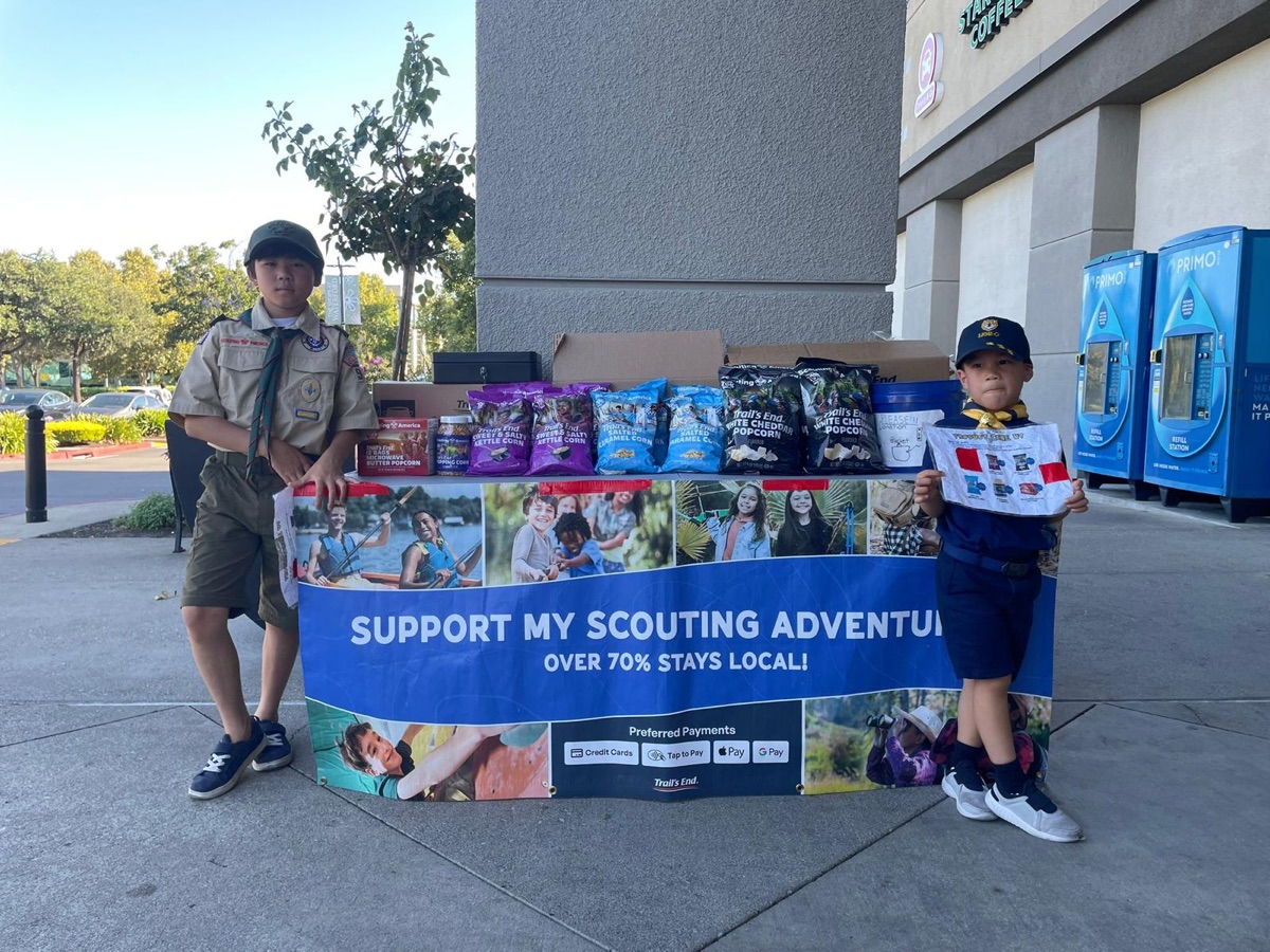 Scouts at a popcorn fundraiser table