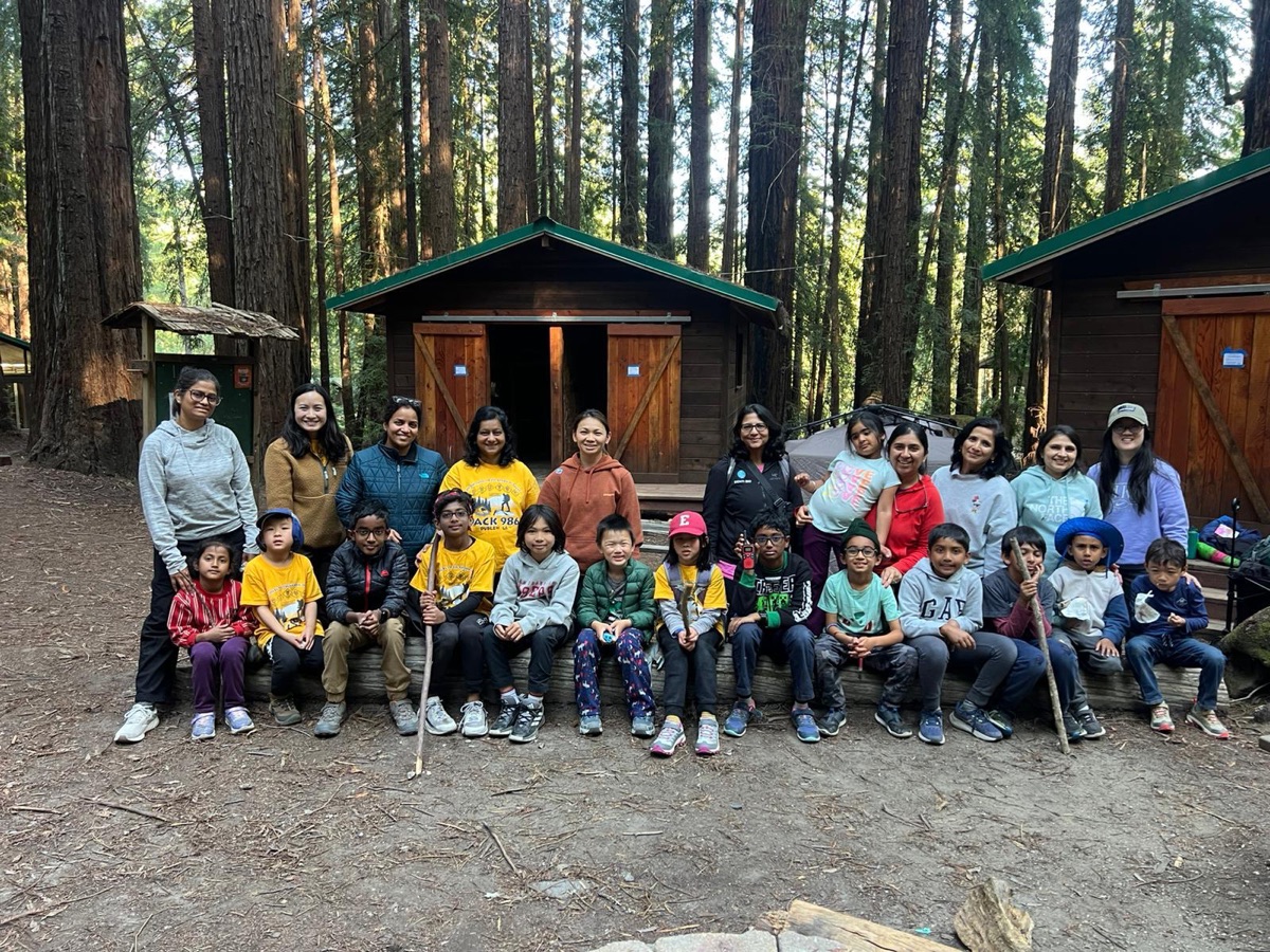 Scouts and parents at a redwood forest campsite